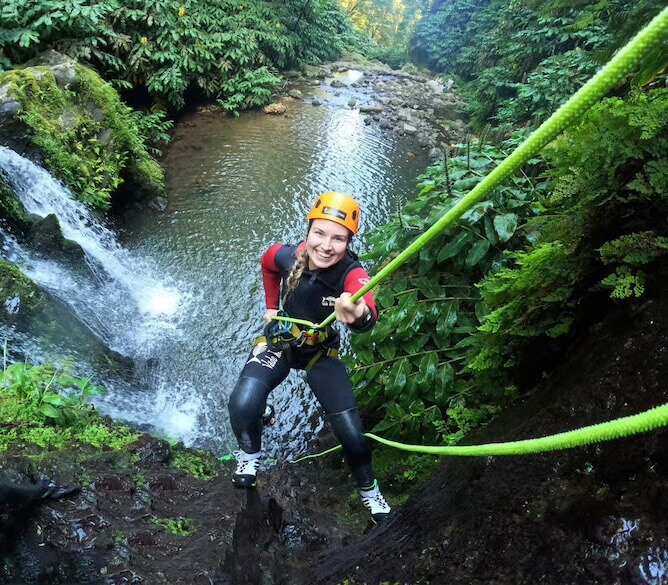 happy woman canyoning