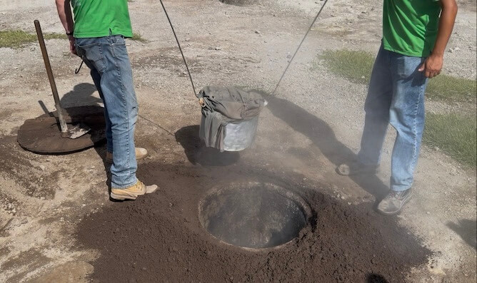 men removing cozido furnas from the ground