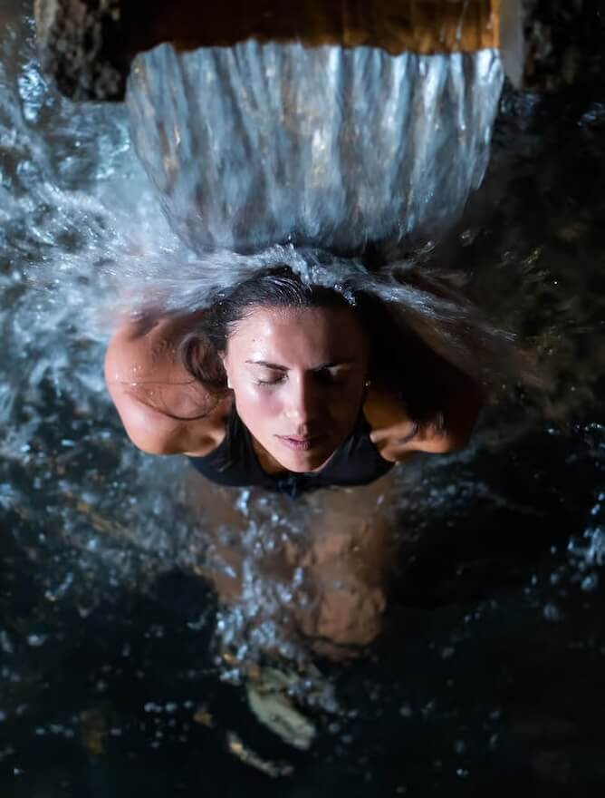 women enjoying water jets